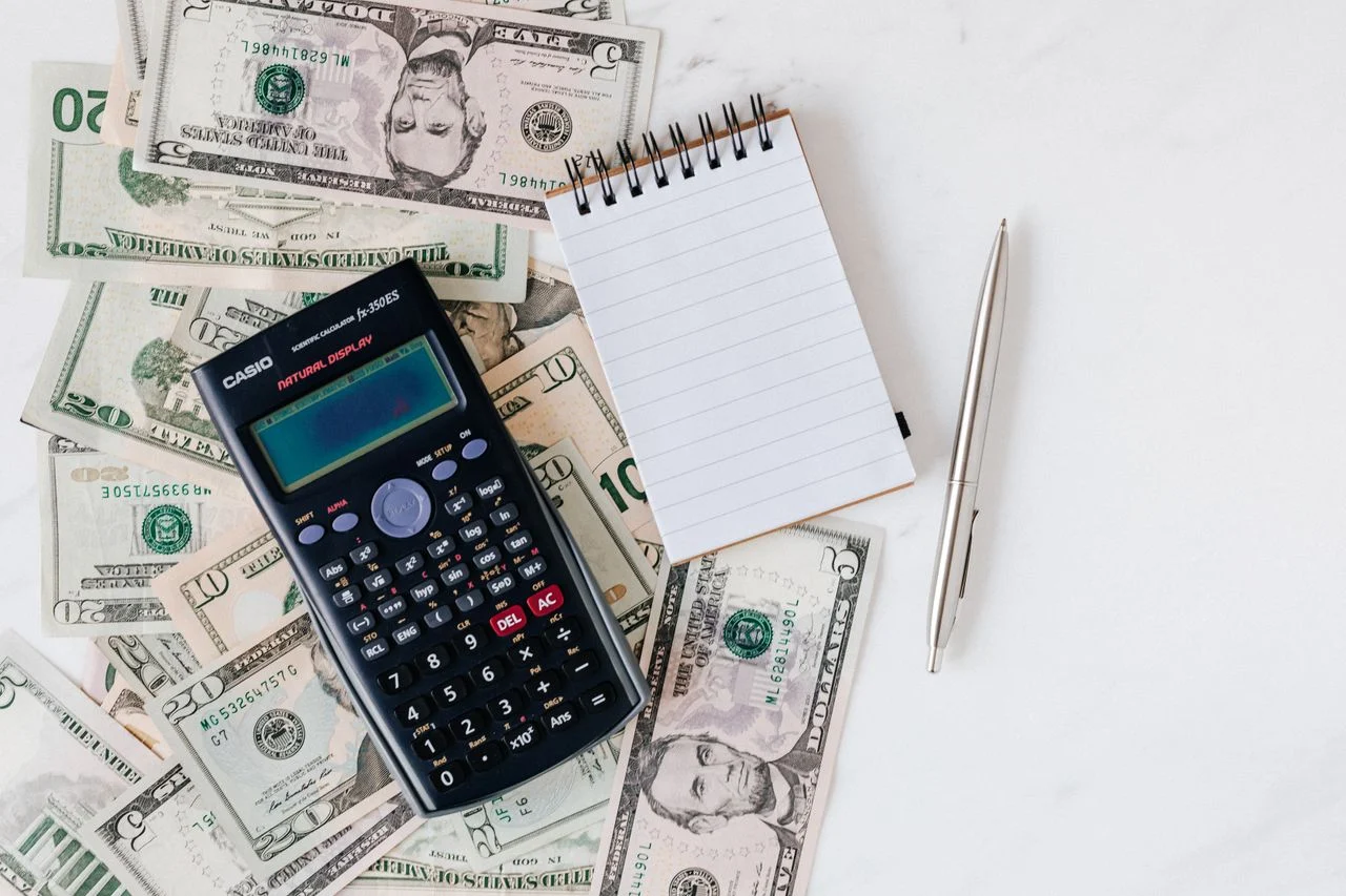 Freelancer reviewing IRS tax deduction forms for self-employed dental insurance premiums