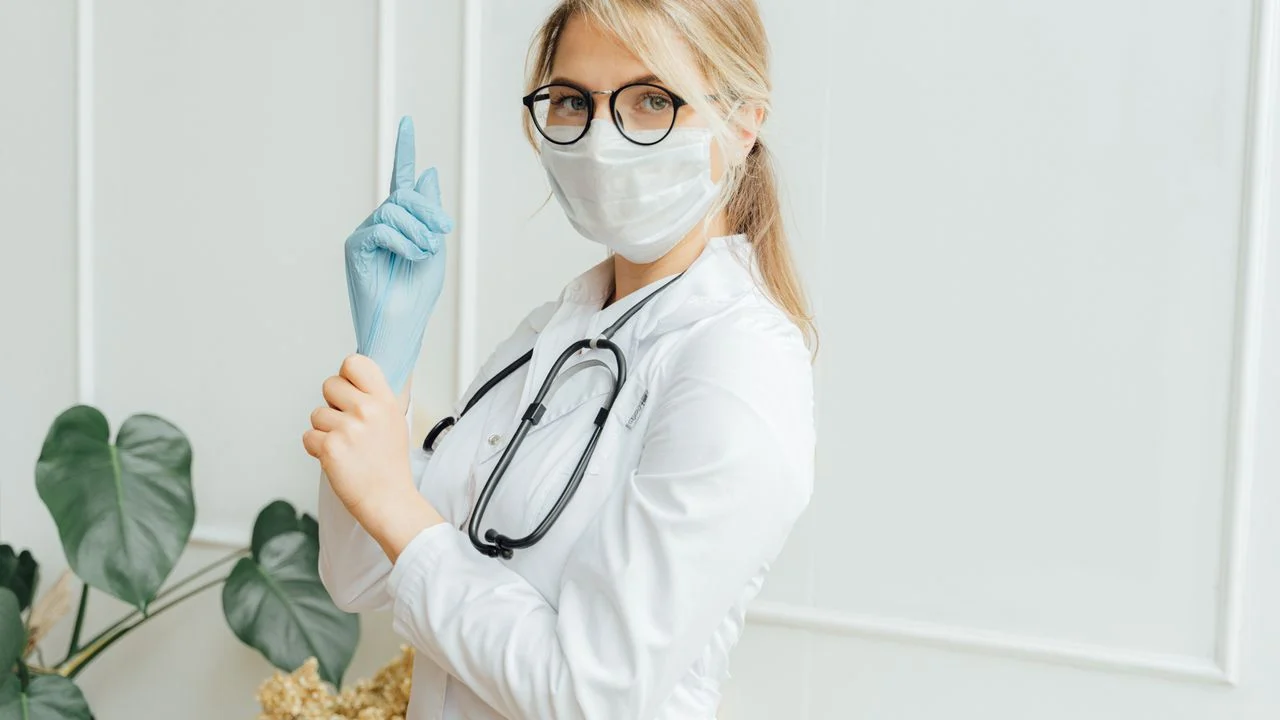Individual reviewing dental insurance plan documents and comparing coverage benefits against a dental discount plan membership option