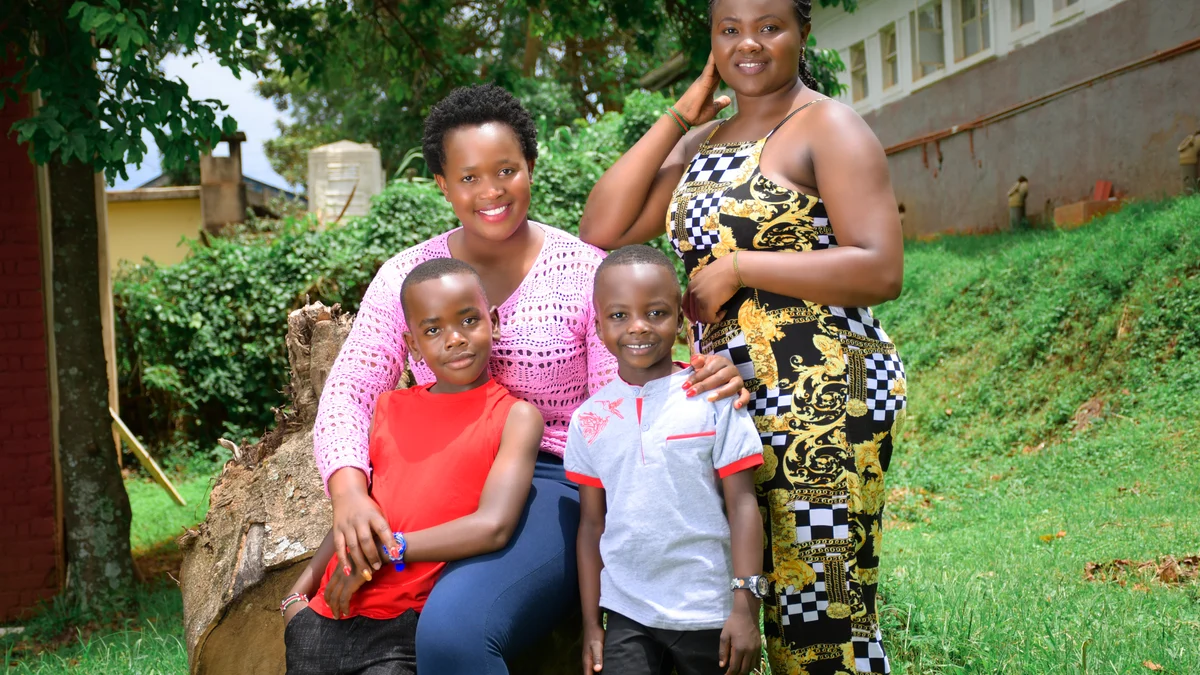 Smiling family of four outdoors, considering Ameritas dental insurance for families Smiling family of four spending time outdoors together, representing families comparing Ameritas dental insurance plans