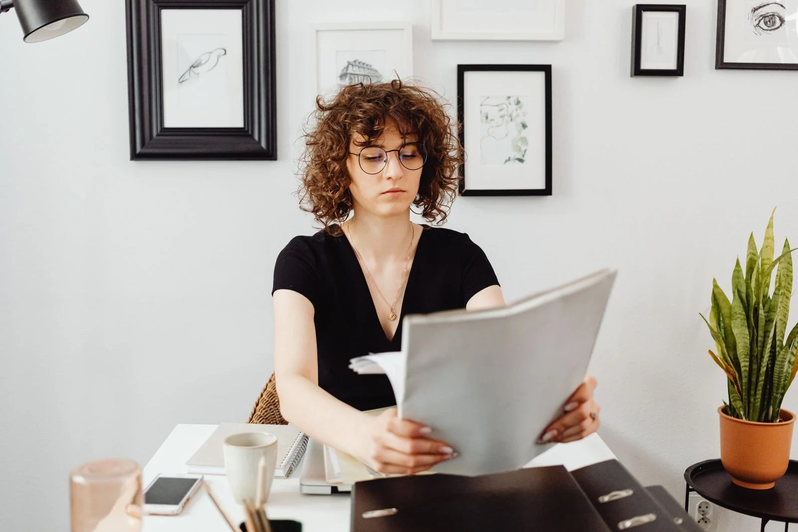 Self-employed professional reviewing insurance options at desk A self-employed professional reviewing dental insurance options at a desk