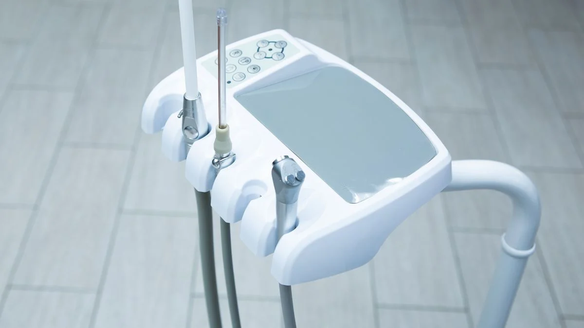 Close-up of high-technology dental tools laid out in a clean, bright clinic
