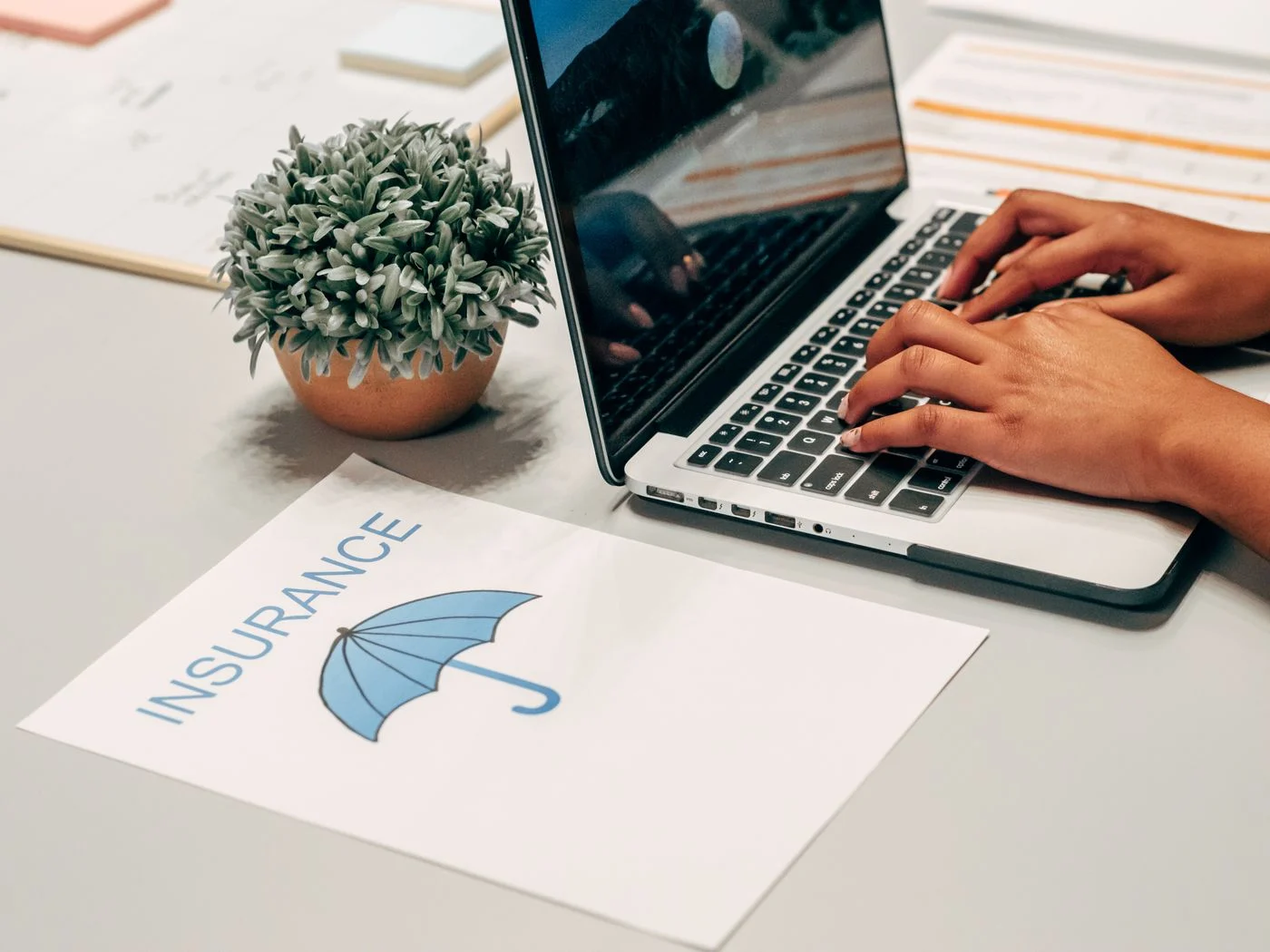 Check which Delta Dental plan you have before assuming coverage A person at a laptop with a dental insurance document on the desk, checking plan benefits