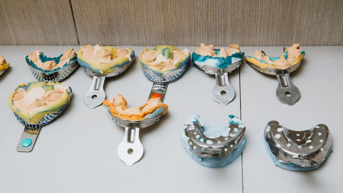 Set of alginate dental impressions on a tray, the step an online lab uses to fabricate a custom night guard